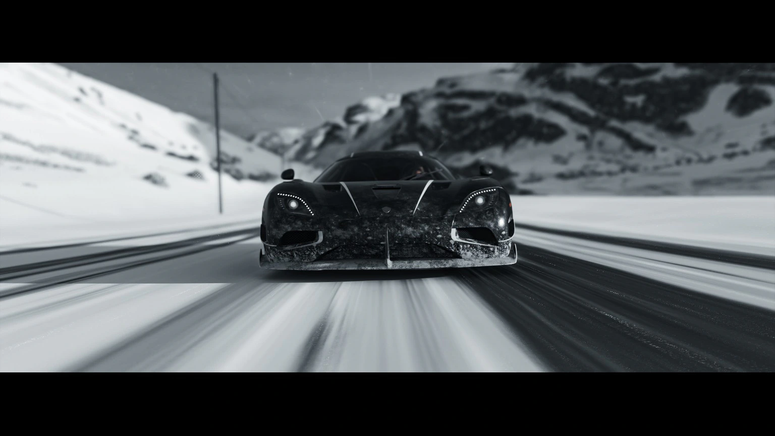 Dark hypercar driving through a snowy mountain landscape