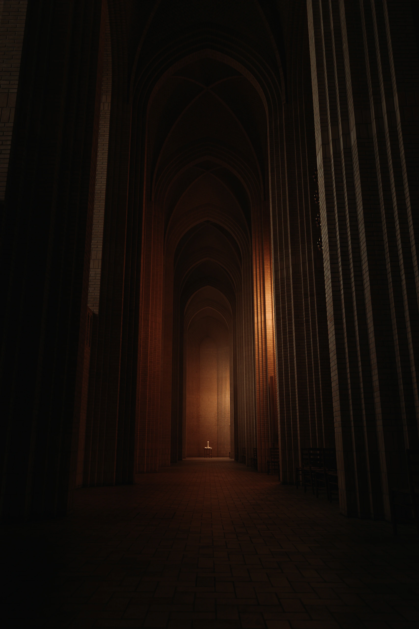 A long side aisle of dark brick arches ending at a small candlelit table