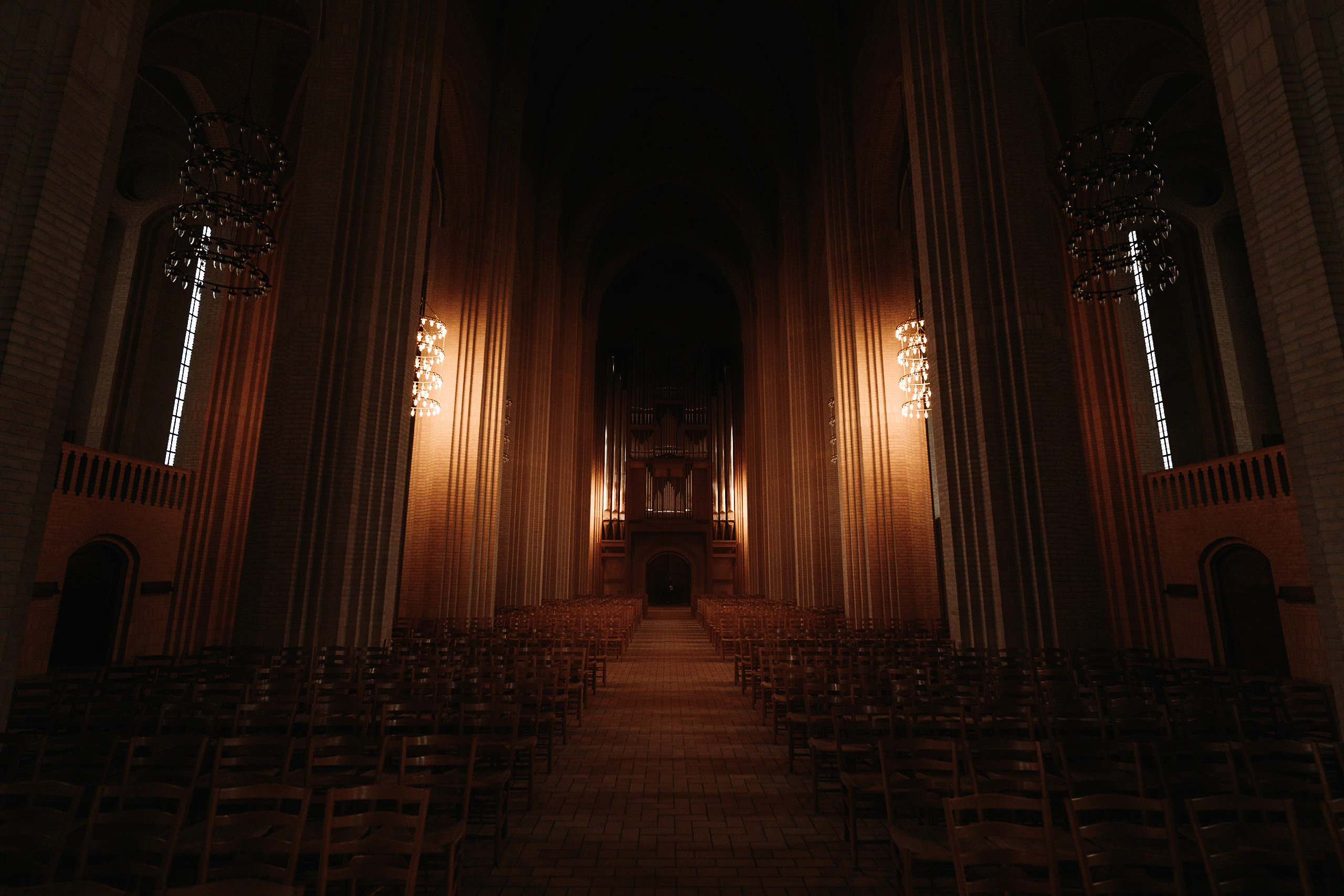 Illuminated columns and the organ inside Grundtvig's Church