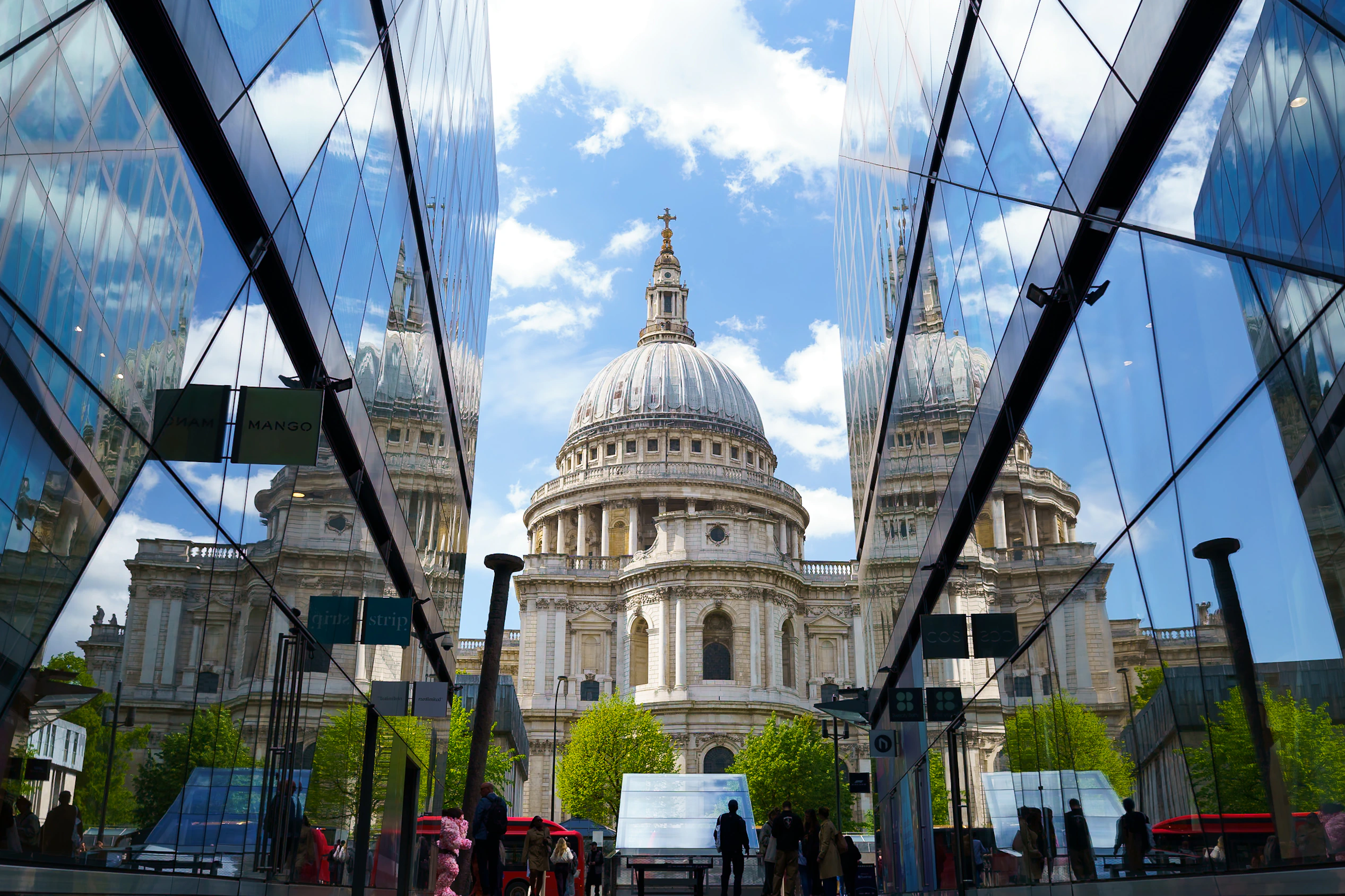 St Paul's Cathedral framed and reflected between modern glass buildings