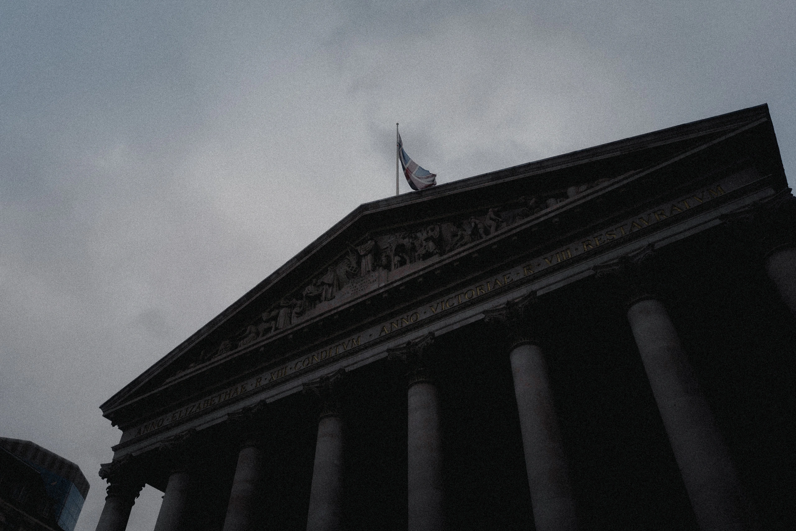 The Royal Exchange seen from below beneath a heavy sky