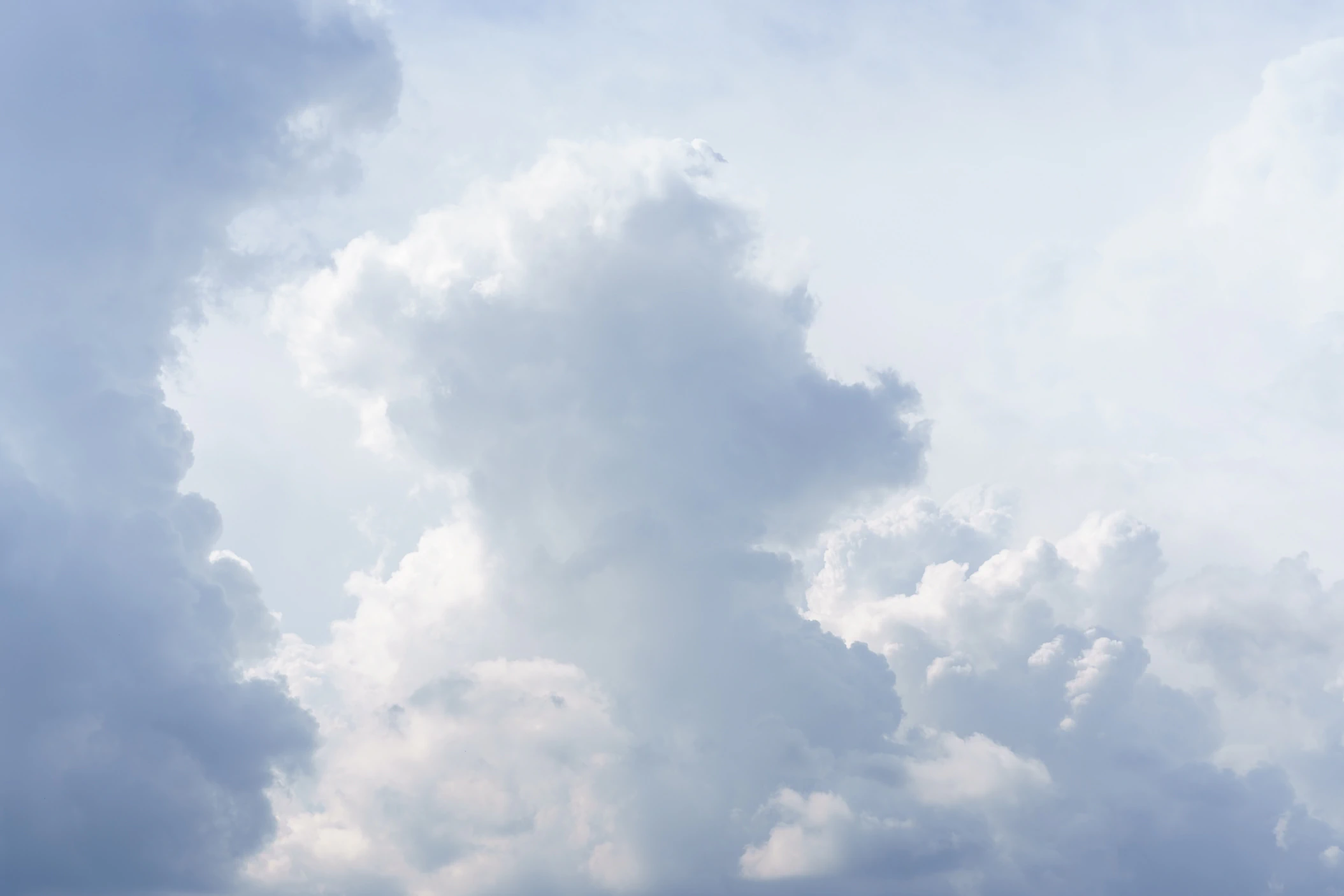 Soft pale clouds dissolving into a bright sky