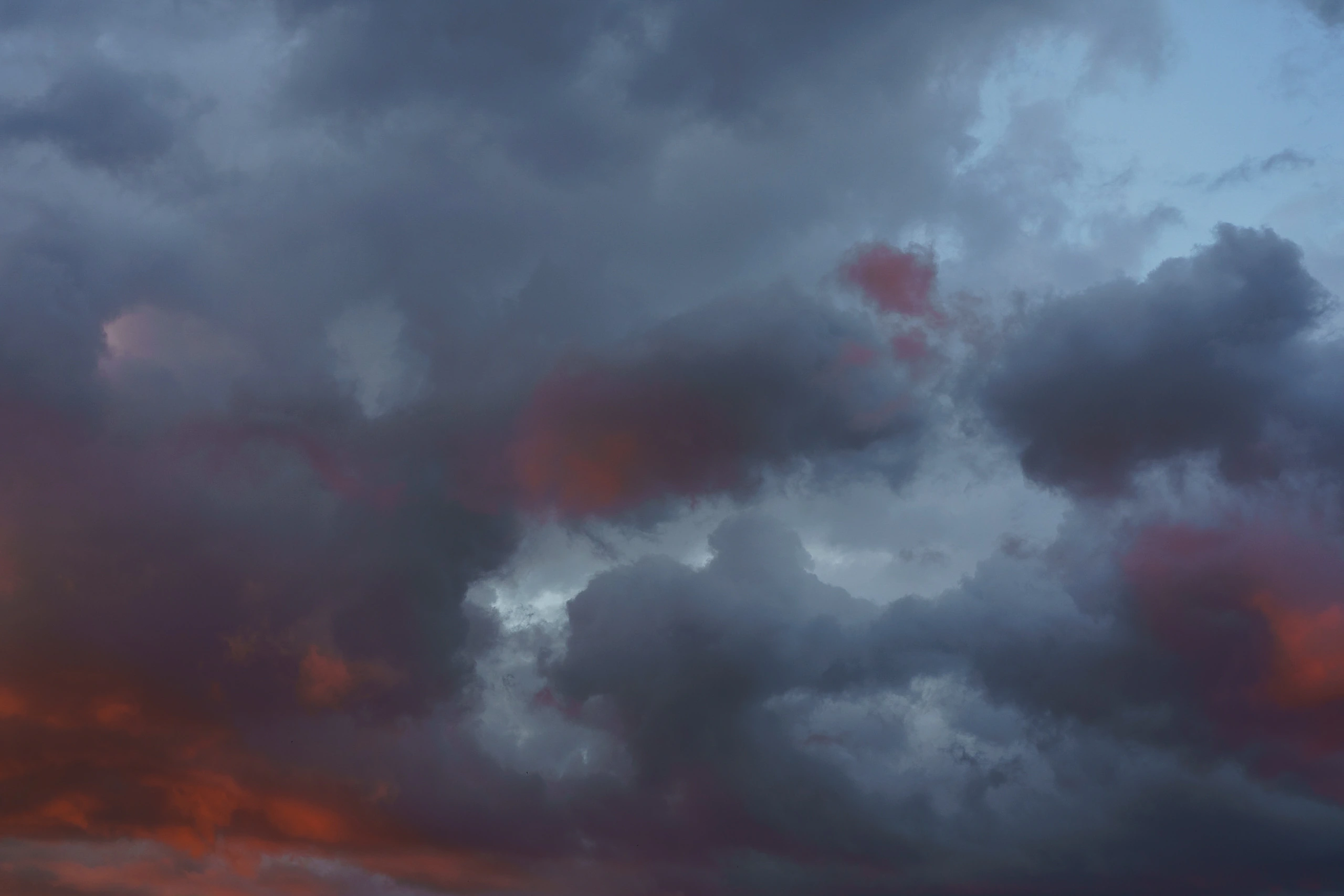 Dark storm clouds with warm light