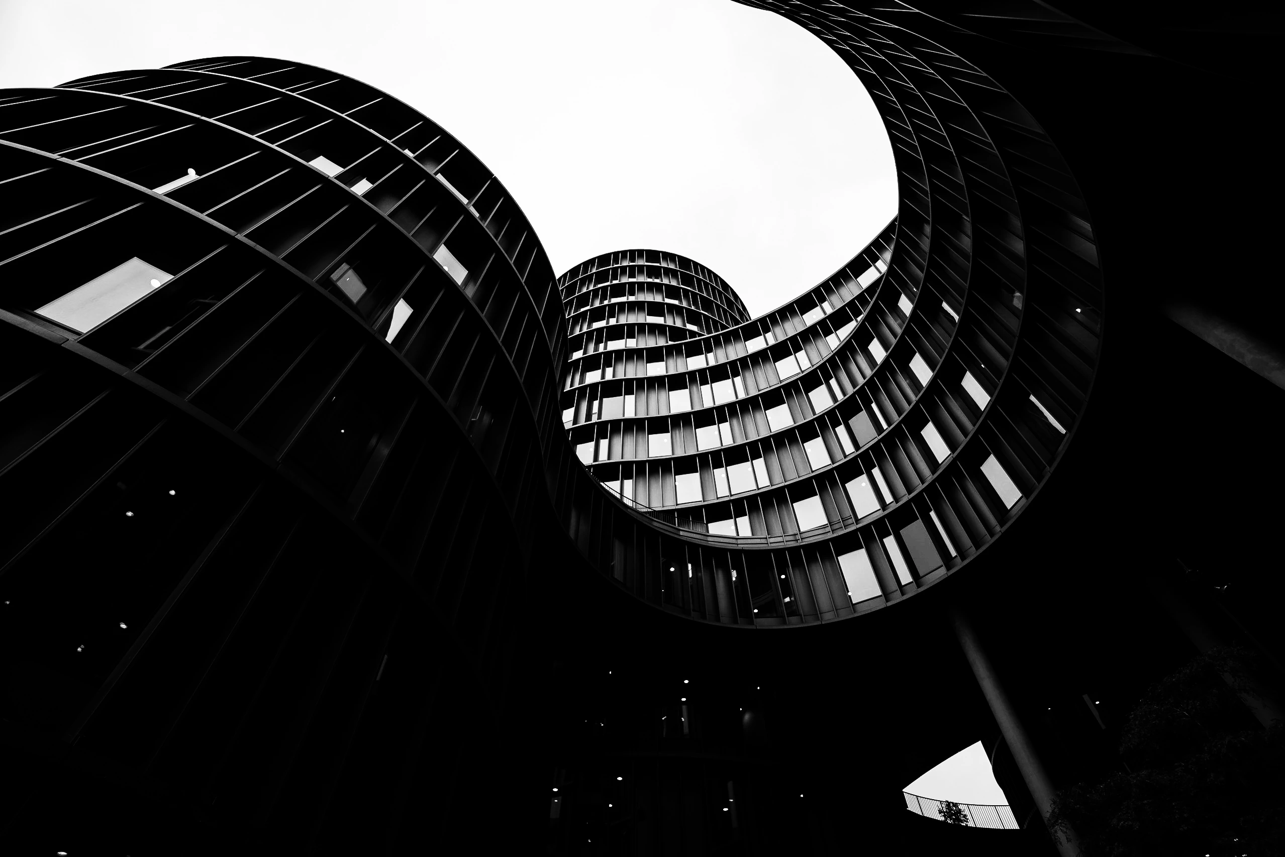 Curved modern buildings forming bold black-and-white shapes